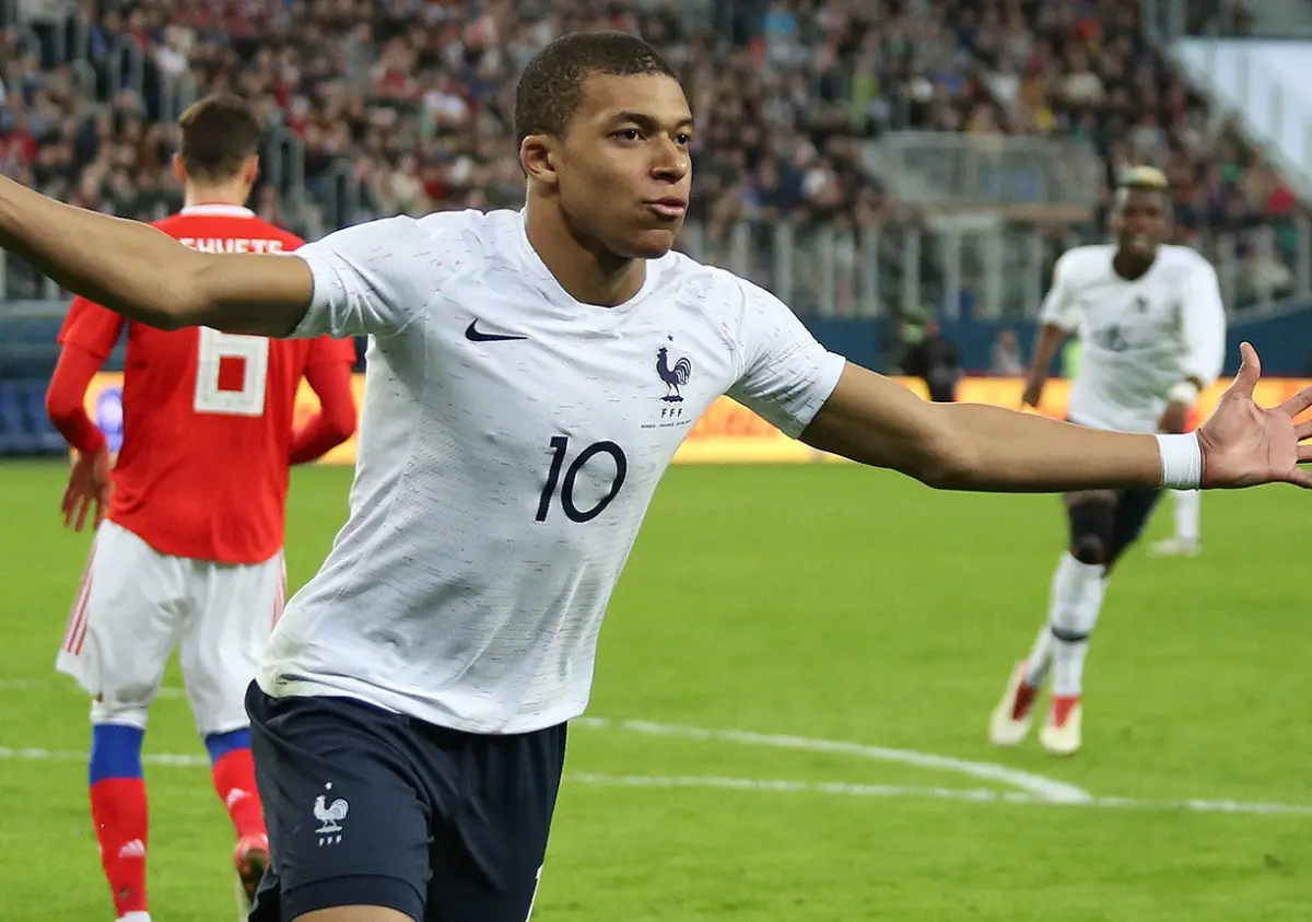 Mbappe double sees France brush aside Iraq and a two-hour storm to reach the knockouts